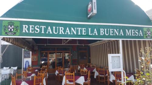 a restaurant with a bunch of tables and chairs at Apartment zona Naturista in Vera