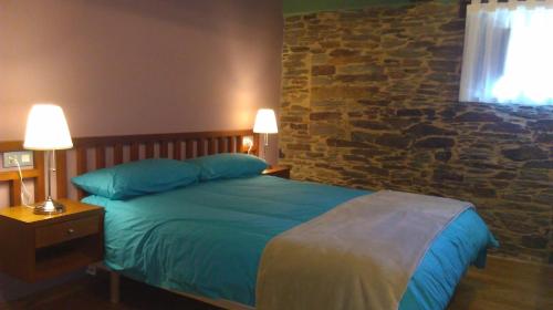 Säng eller sängar i ett rum på Casa Do Grilo