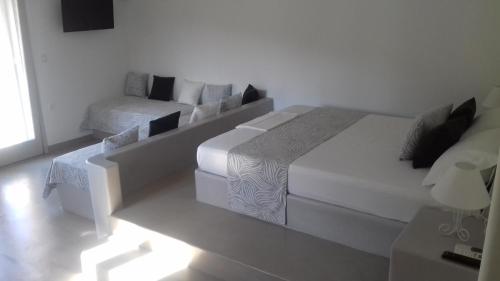 Ένα ή περισσότερα κρεβάτια σε δωμάτιο στο Notos Villa