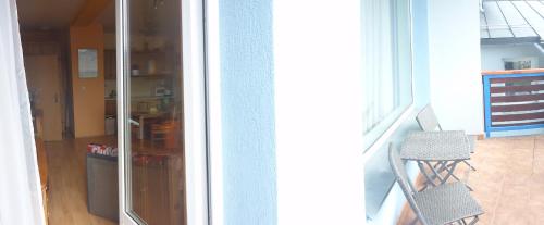 a view of a kitchen with a sliding glass door at Apartmány Bea Donovaly in Donovaly