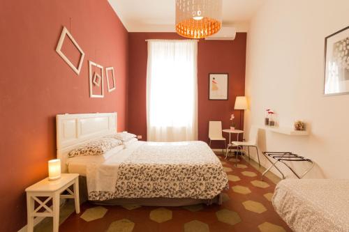 a bedroom with two beds and a window at Stazione Vaticana 5 Apartment in Rome