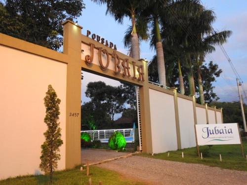 a building with a sign that reads royal costachi at Pousada Jubaia in Bonito