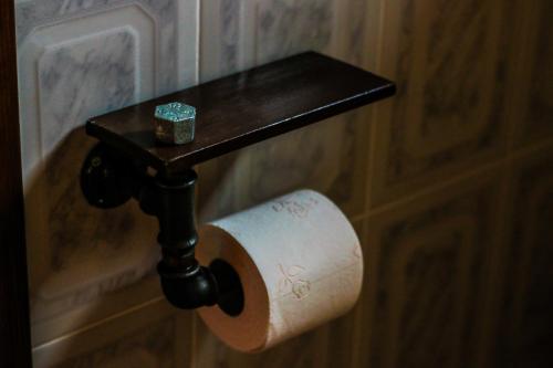 a roll of toilet paper hanging on a wall at Mylos in Arkochórion