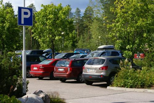 a bunch of cars parked in a parking lot at Finlandia Hotel Imatran Kylpylä Spa in Imatra