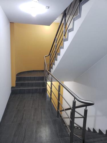 a set of stairs in a building with a railing at Residencial Cafferata in Lima
