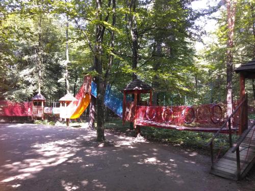 a playground in a park with a slide at Апартаменти in Truskavets