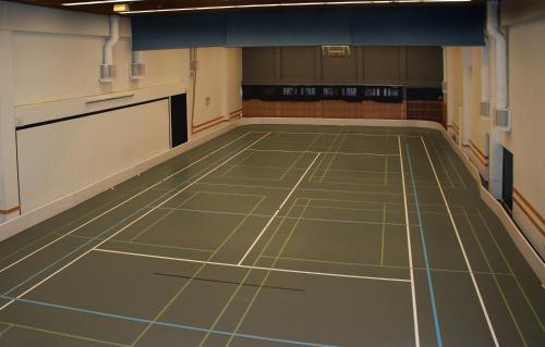 an empty gym with a green floor in a room at Finlandia Hotel Imatran Kylpylä Spa in Imatra