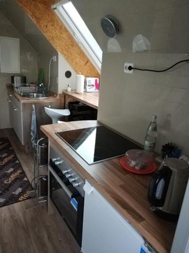 a kitchen with a stove and a counter top at Lovely Studio in Cannstatt in Stuttgart