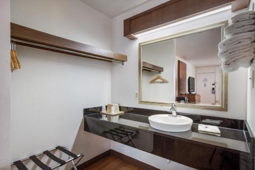 a bathroom with a sink and a mirror at Motel 6-Van Buren, AR I- 40 in Van Buren