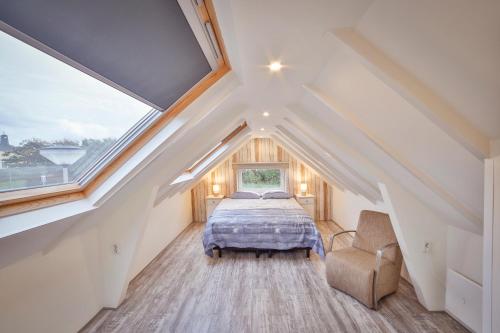 Ένα ή περισσότερα κρεβάτια σε δωμάτιο στο Het hoekhuisje