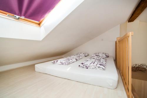 a bedroom with a bed in a attic at LaNoblessa in Prague