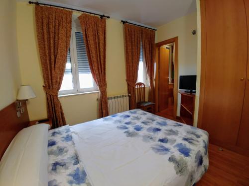 Postel nebo postele na pokoji v ubytování Hostal Prada Borges