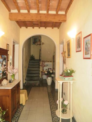 a hallway of a home with an archway and stairs at BeB Angelini dal 1911 in Lucca