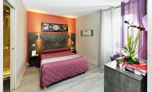 Postel nebo postele na pokoji v ubytování Hôtel Concorde - Rodez Centre Ville