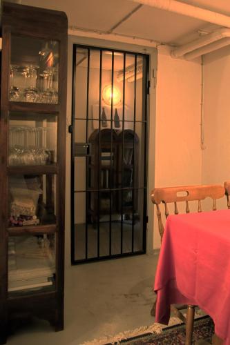 a door to a room with a table and a chair at Hovborg Kro in Hovborg