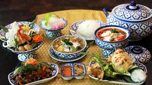 a table topped with bowls of food on a table at Hyatt Regency Bangkok Suvarnabhumi Airport in Lat Krabang