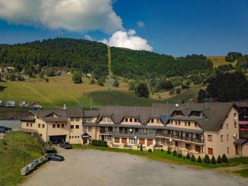 an aerial view of a large building in the mountains at Apartmán Magura Donovaly in Donovaly