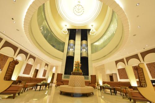 a large room with a large clock on the ceiling at Ramada Plaza Chennai in Chennai