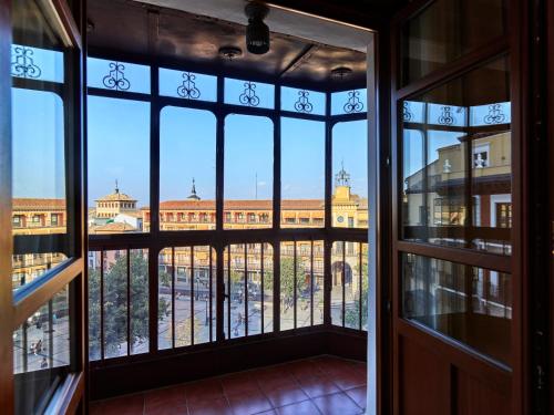 a view of the city from the window of a building at Hotel Boutique ADOLFO in Toledo