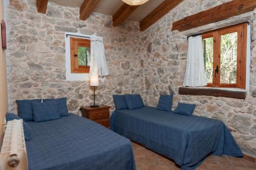 Postel nebo postele na pokoji v ubytování Casa De Piedra
