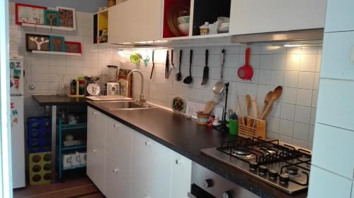 a kitchen with a sink and a counter top at La casa di Antonella in Nicolosi