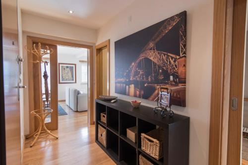 a room with a painting of the eiffel tower at 2 Bedroom Belem Wonder by LovelyStay in Lisbon
