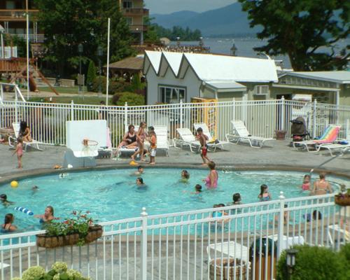 a group of people in a swimming pool at Marine Village Resort in Lake George