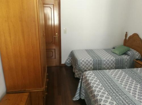 Katil atau katil-katil dalam bilik di Hostal La Casilla