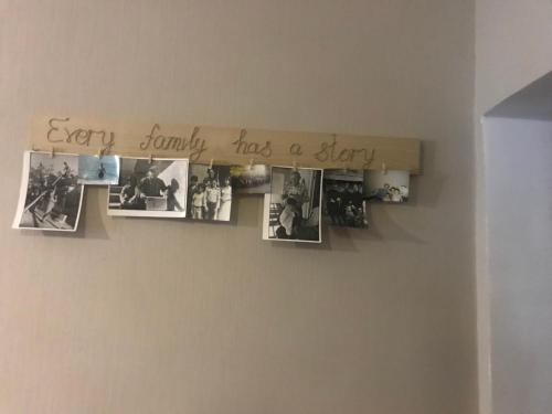 a sign on a wall with pictures on it at Guesthouse Chela in Mestia