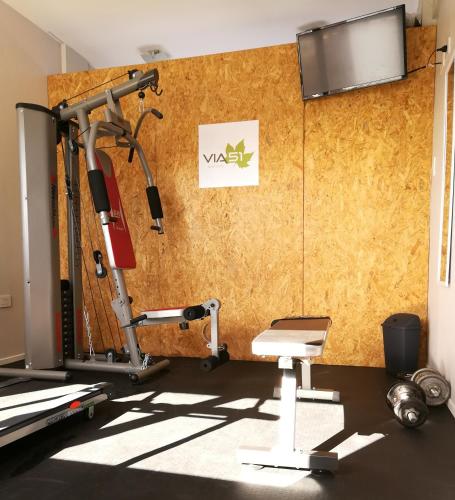 a room with a gym with a treadmill at Apart Hotel Via 51 in La Plata