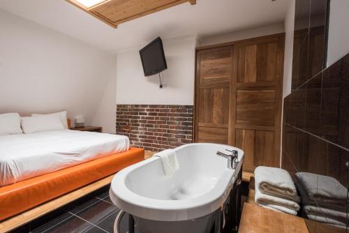 Postel nebo postele na pokoji v ubytování Hotel Una