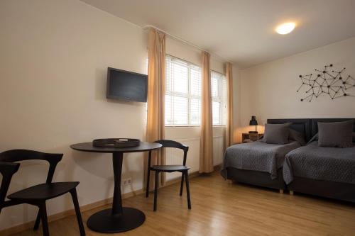 Postel nebo postele na pokoji v ubytování Hotel Frón