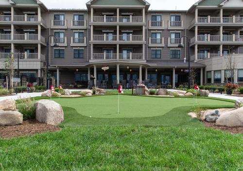 a golf course in front of a hotel at Chautauqua Harbor Hotel - Jamestown in Celoron