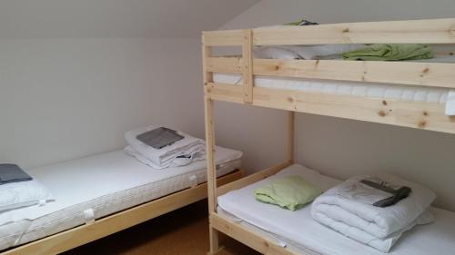 two bunk beds with towels on them in a room at Apartment near Frankfurt, fantastic view! in Usingen