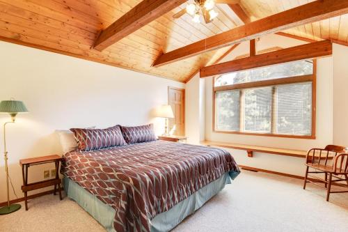 a bedroom with a bed and a large window at Wren Ridge in Pagosa Springs