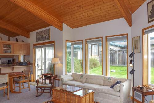 a living room with a couch and a table at 9 Condo in Lopez