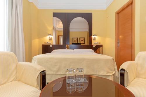 Un ou plusieurs lits dans un hébergement de l'établissement Hotel Soho Boutique Jerez