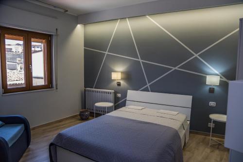 Postel nebo postele na pokoji v ubytování B&b Cortile Aurora