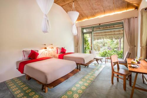 Кровать или кровати в номере Mekong Home