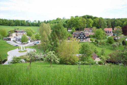 a small town in the middle of a green field at Sonnenschein Appartement in Ober-Hambach