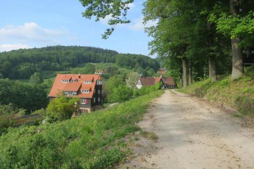a dirt road with houses on the side of a hill at Sonnenschein Appartement in Ober-Hambach