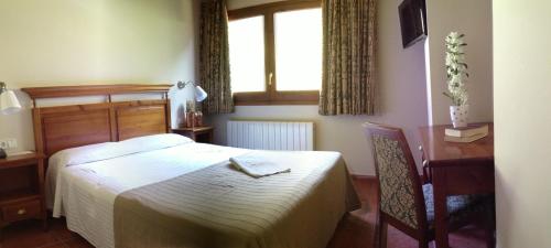 Cama o camas de una habitación en Hotel Xalet Verdú