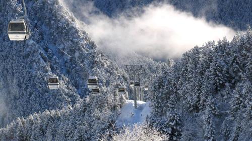 a snow covered mountain with a ski lift at Hotel Xalet Verdú in Arinsal