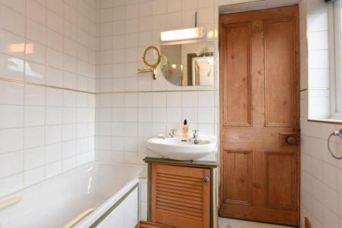 a bathroom with a sink and a bath tub and a sink at Johnson Road Near Erdington Station in Birmingham