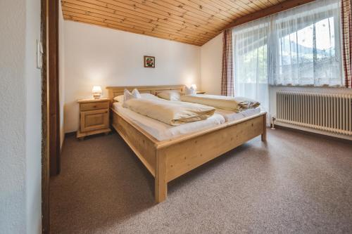 Postel nebo postele na pokoji v ubytování Haus Kristall