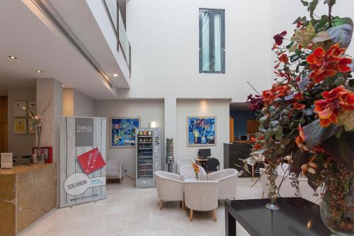 TV a/nebo společenská místnost v ubytování Hotel AACR Museo
