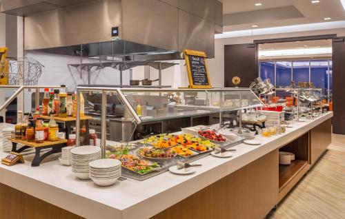 a buffet line in a restaurant with a lot of food at The Summit Hotel in Cincinnati