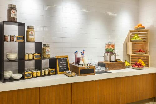 a kitchen with a counter with food on it at The Summit Hotel in Cincinnati
