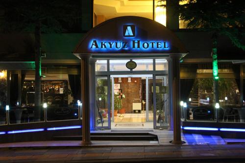 aania hotel sign in front of a building at night at Akyuz Hotel in Ankara