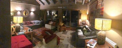 a living room with couches and tables and two lamps at Hotel Boutique BC Wine Casablanca in Casablanca